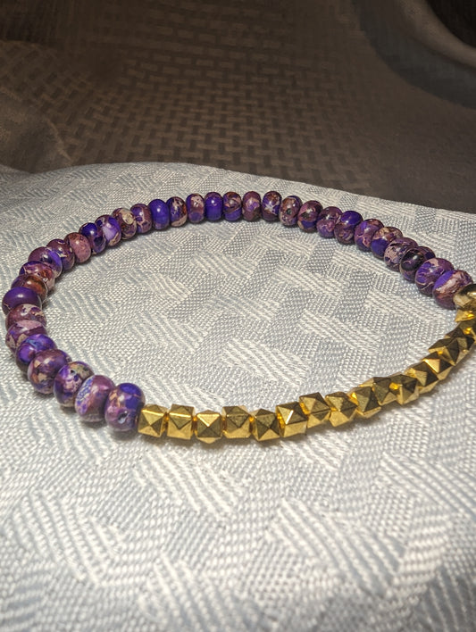 Purple Regalite beads with gold accents bracelet