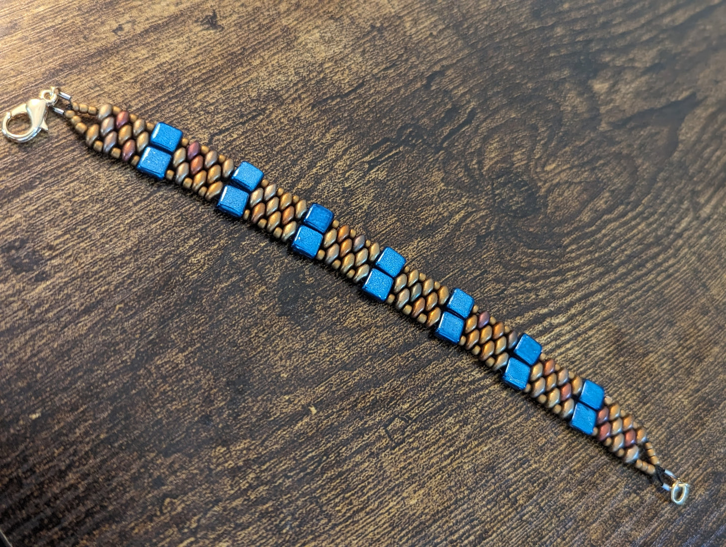 Blue square glass beads with bronze superduo and seed beads