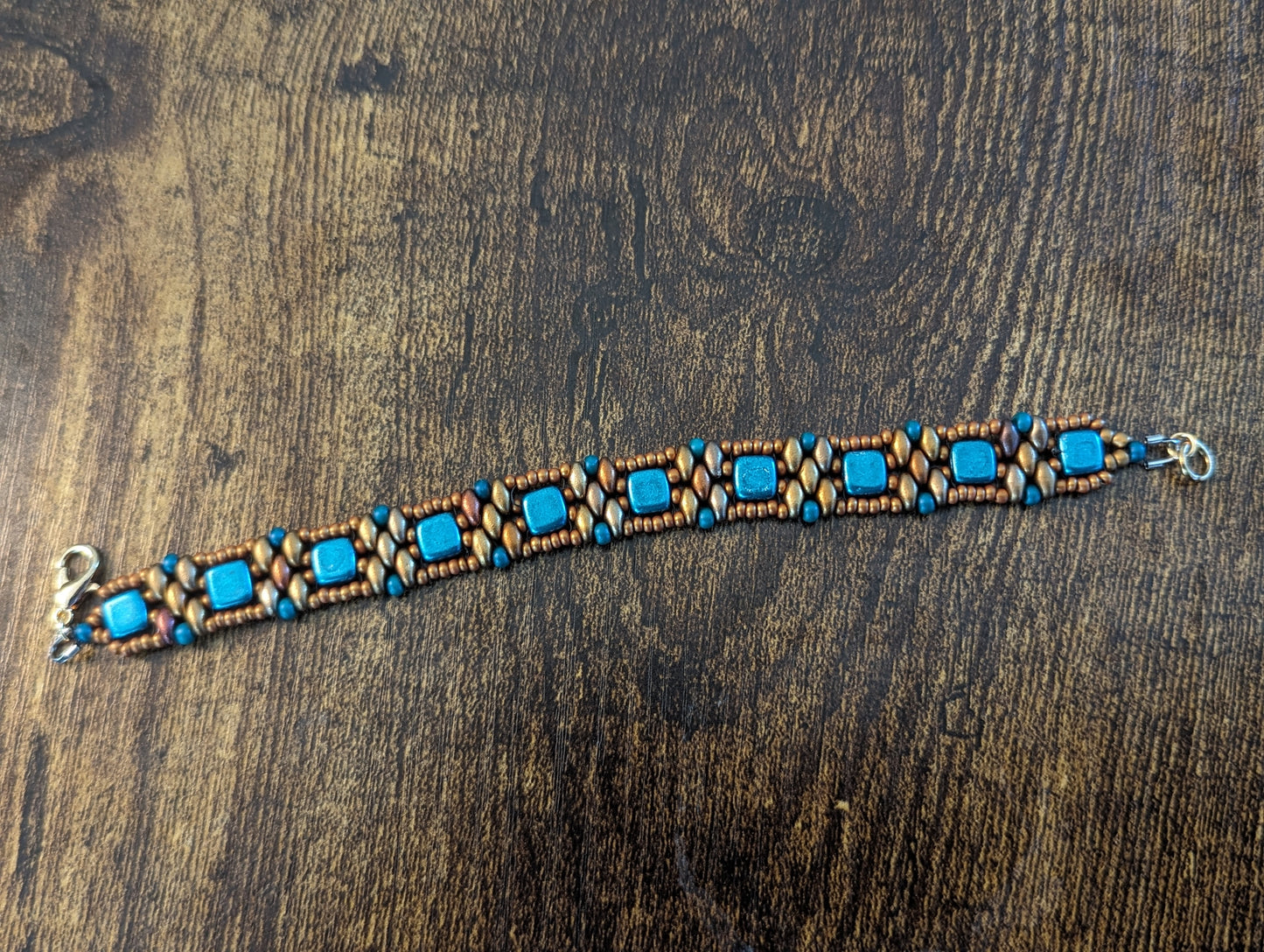 Blue square glass beads with bronze superduo and seed beads